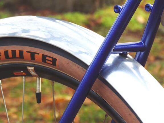 Nancy riding her Rodriguez touring bicycle